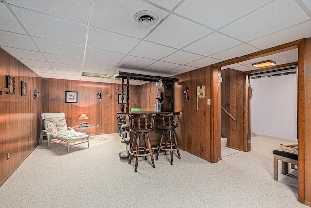 1136 3 Mile Rd NW, Grand Rapids, MI 49544 - dining room featuring a bar, wood walls, carpet, and a drop ceiling