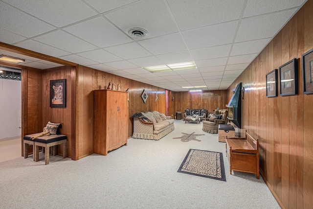 1136 3 Mile Rd NW, Grand Rapids, MI 49544 - living room featuring wooden walls, carpet floors, and a drop ceiling