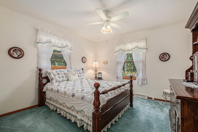 1136 3 Mile Rd NW, Grand Rapids, MI 49544 - carpeted bedroom featuring baseboards and a ceiling fan