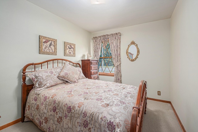 1136 3 Mile Rd NW, Grand Rapids, MI 49544 - carpeted bedroom with baseboards