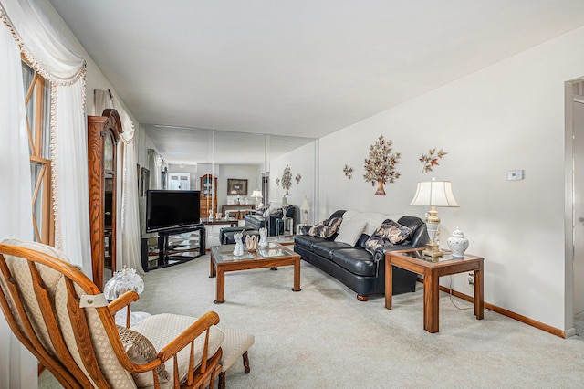 1136 3 Mile Rd NW, Grand Rapids, MI 49544 - living room with carpet floors and baseboards