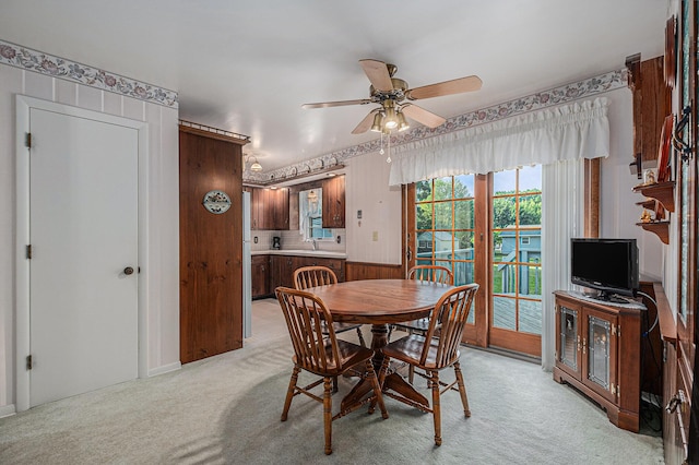 1136 3 Mile Rd NW, Grand Rapids, MI 49544 - dining area featuring light carpet and a ceiling fan