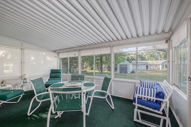 1136 3 Mile Rd NW, Grand Rapids, MI 49544 - sunroom with outdoor dining area and lofted ceiling
