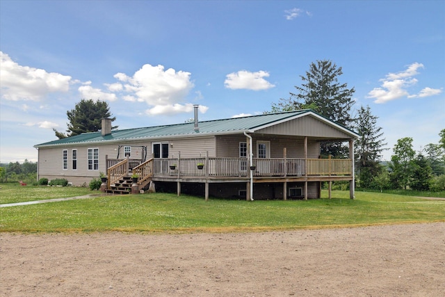 21576 220th Ave, Tustin, MI 49688 - view of front facade with a front yard, a metal roof, and a deck