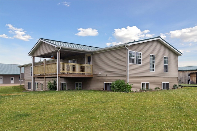 21576 220th Ave, Tustin, MI 49688 - back of property with a lawn, a standing seam roof, and a metal roof
