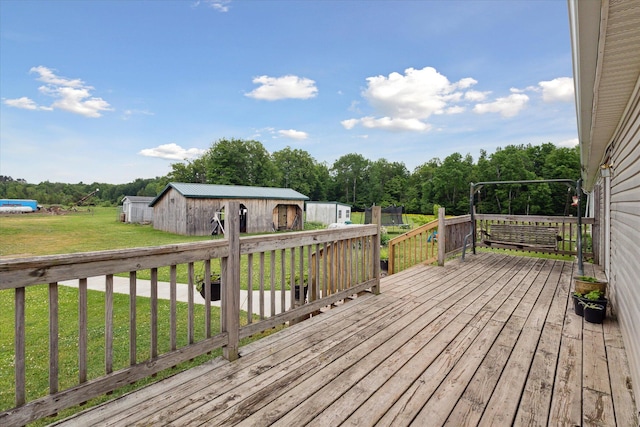 21576 220th Ave, Tustin, MI 49688 - wooden deck featuring a lawn and an outdoor structure