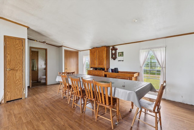 21576 220th Ave, Tustin, MI 49688 - dining room featuring ornamental molding and light wood-style floors