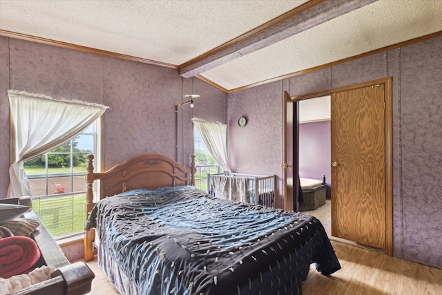 21576 220th Ave, Tustin, MI 49688 - bedroom with ornamental molding, wood finished floors, a textured ceiling, and lofted ceiling