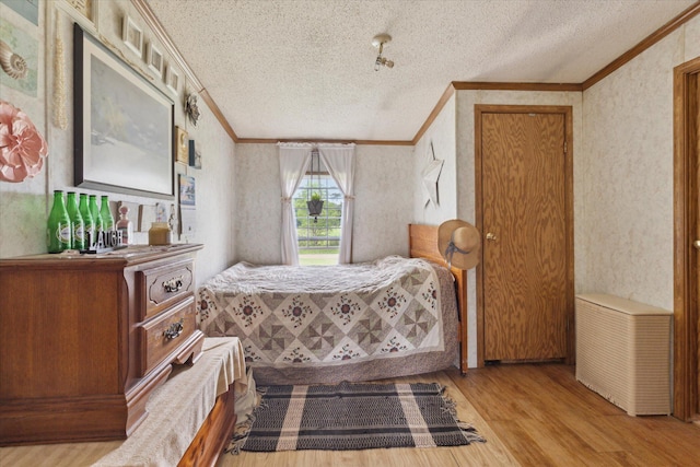21576 220th Ave, Tustin, MI 49688 - bedroom featuring crown molding, wood finished floors, and a textured ceiling