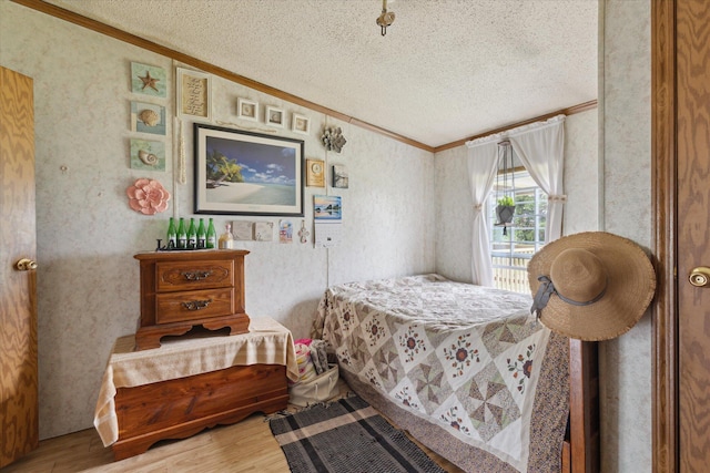 21576 220th Ave, Tustin, MI 49688 - bedroom with crown molding, a textured ceiling, and wood finished floors