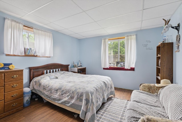 21576 220th Ave, Tustin, MI 49688 - bedroom with a paneled ceiling and wood finished floors