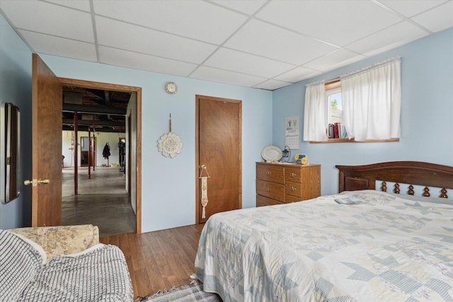 21576 220th Ave, Tustin, MI 49688 - bedroom with a drop ceiling and wood finished floors
