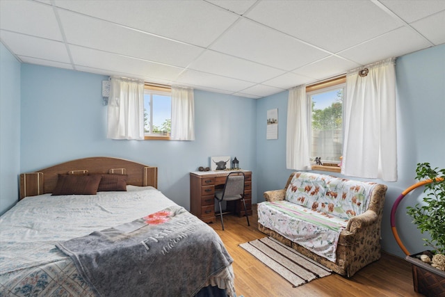 21576 220th Ave, Tustin, MI 49688 - bedroom with a paneled ceiling and wood finished floors