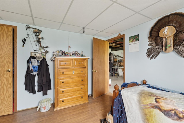 21576 220th Ave, Tustin, MI 49688 - bedroom featuring a paneled ceiling and wood finished floors