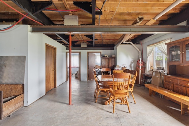 21576 220th Ave, Tustin, MI 49688 - dining area featuring concrete flooring