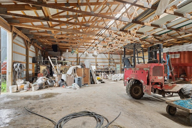 21576 220th Ave, Tustin, MI 49688 - garage featuring a workshop area