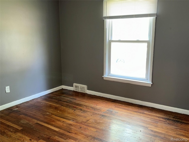 18582 Edinborough Rd, Detroit, MI 48219 - spare room featuring healthy amount of natural light and dark wood finished floors