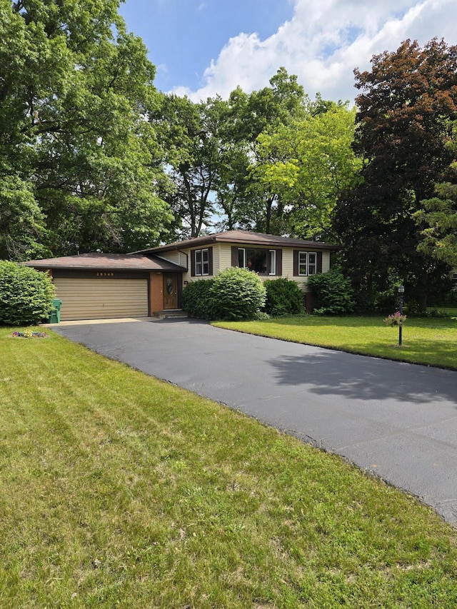 28548 Fairlane Dr, Dowagiac, MI 49047 - view of front of property with driveway, a front lawn, and an attached garage