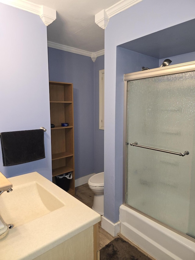 28548 Fairlane Dr, Dowagiac, MI 49047 - bathroom featuring crown molding, wood finished floors, vanity, and shower / bath combination with glass door