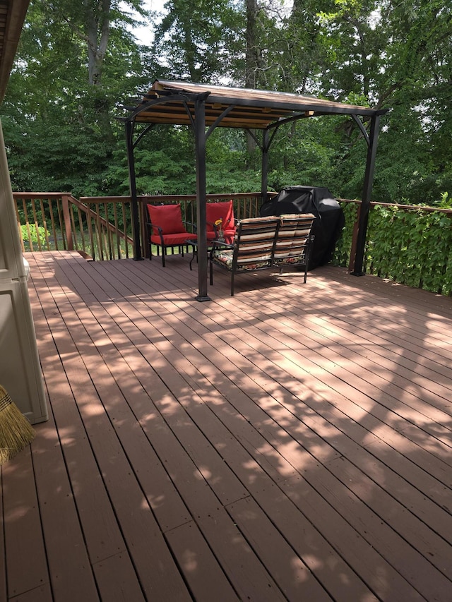 28548 Fairlane Dr, Dowagiac, MI 49047 - deck with outdoor lounge area and view of wooded area