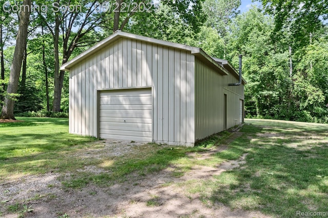 13256 Pine Valley Dr, Clio, MI 48420 - detached garage featuring driveway