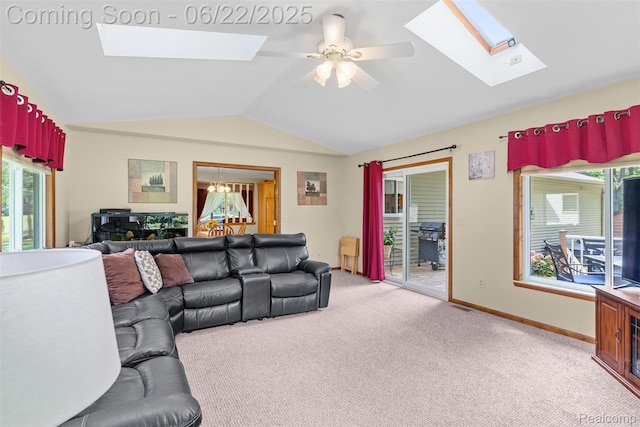 13256 Pine Valley Dr, Clio, MI 48420 - living area featuring a skylight, vaulted ceiling, light carpet, ceiling fan, and a chandelier