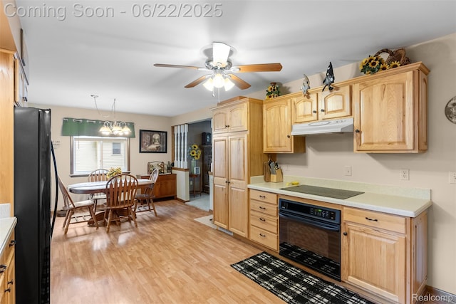 13256 Pine Valley Dr, Clio, MI 48420 - kitchen with black appliances, under cabinet range hood, light brown cabinetry, and light countertops