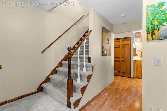 13256 Pine Valley Dr, Clio, MI 48420 - stairs with baseboards and wood finished floors