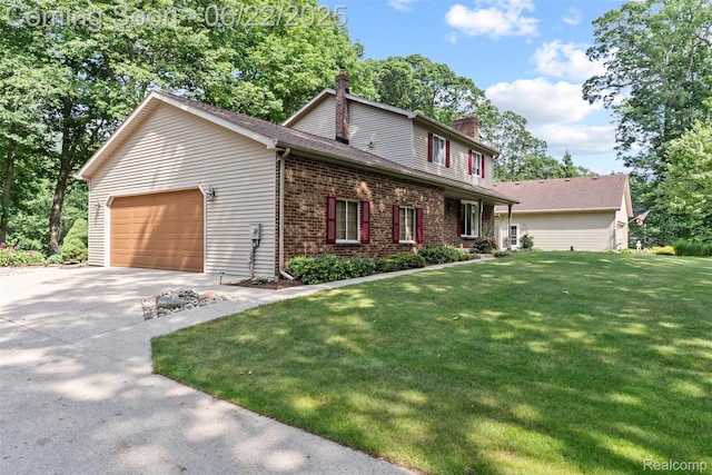 13256 Pine Valley Dr, Clio, MI 48420 - view of front facade featuring a chimney, driveway, brick siding, a garage, and a front yard