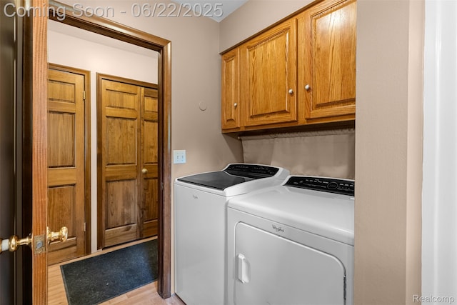 13256 Pine Valley Dr, Clio, MI 48420 - washroom with washing machine and clothes dryer, cabinet space, and light wood-style floors