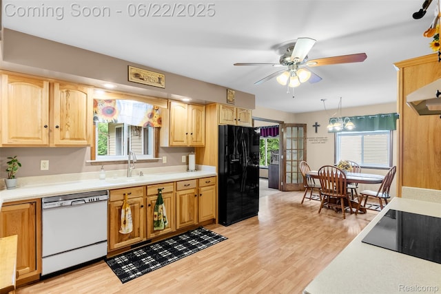 13256 Pine Valley Dr, Clio, MI 48420 - kitchen with black appliances, light countertops, and plenty of natural light