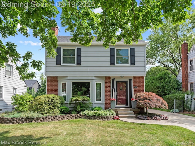 1668 Villa Rd, Birmingham, MI 48009 - colonial house with brick siding and concrete driveway