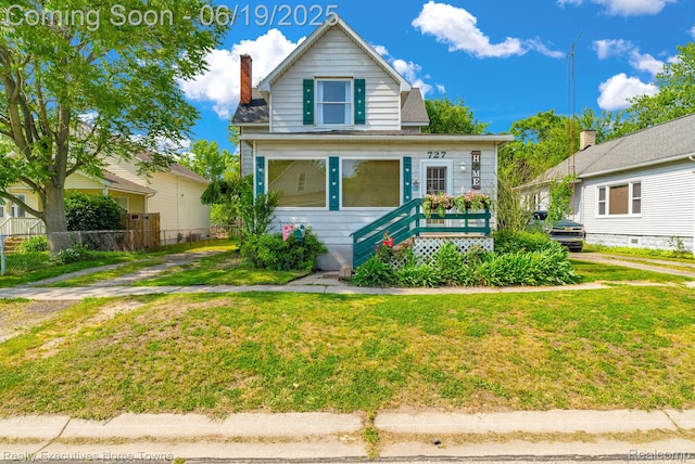 727 Minnie St, Port Huron, MI 48060 - view of front of property with a chimney