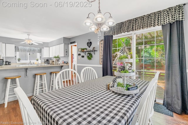 727 Minnie St, Port Huron, MI 48060 - dining room featuring a chandelier, wood finished floors, and a ceiling fan