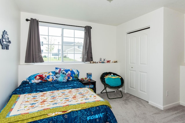 1633 Tea Pond Ct, Vicksburg, MI 49097 - carpeted bedroom with baseboards and a closet