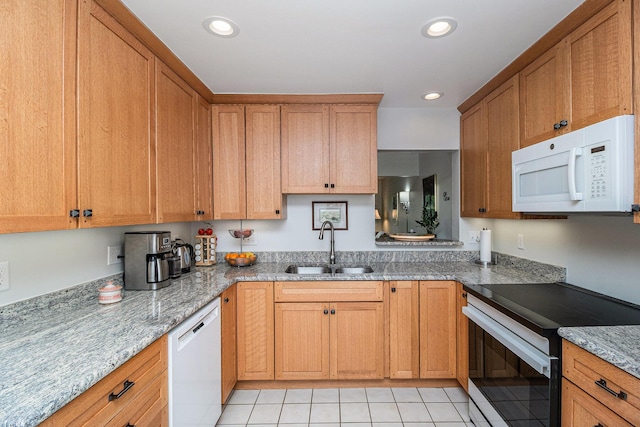 2519 Meade Ct, Ann Arbor, MI 48105 - kitchen with white appliances, light tile patterned floors, light stone counters, recessed lighting, and brown cabinets