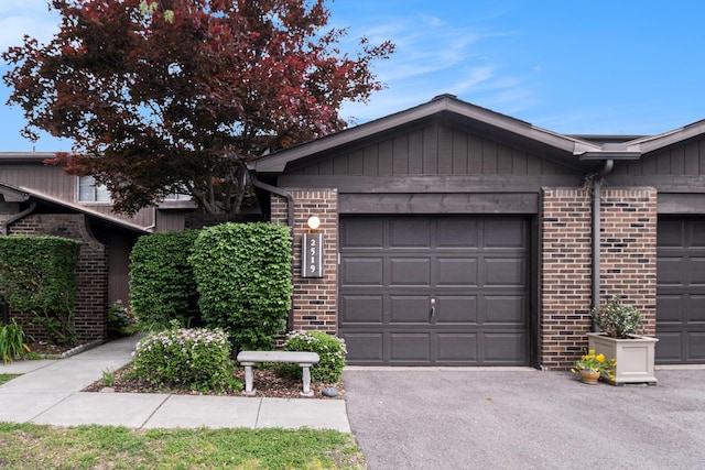2519 Meade Ct, Ann Arbor, MI 48105 - view of front facade featuring brick siding and driveway