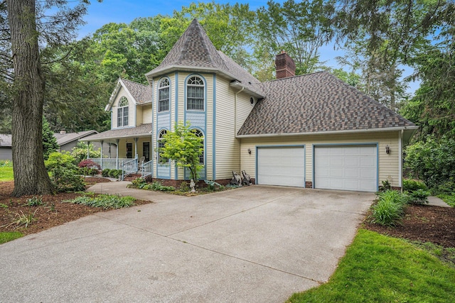 4686 Doug Dr, Whitehall, MI 49461 - victorian house featuring a chimney, driveway, roof with shingles, covered porch, and a garage