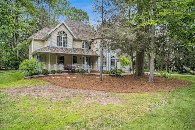 4686 Doug Dr, Whitehall, MI 49461 - view of front of house with covered porch, a front lawn, and a shingled roof