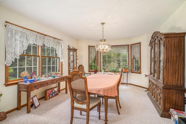 4686 Doug Dr, Whitehall, MI 49461 - dining space with a chandelier and light colored carpet