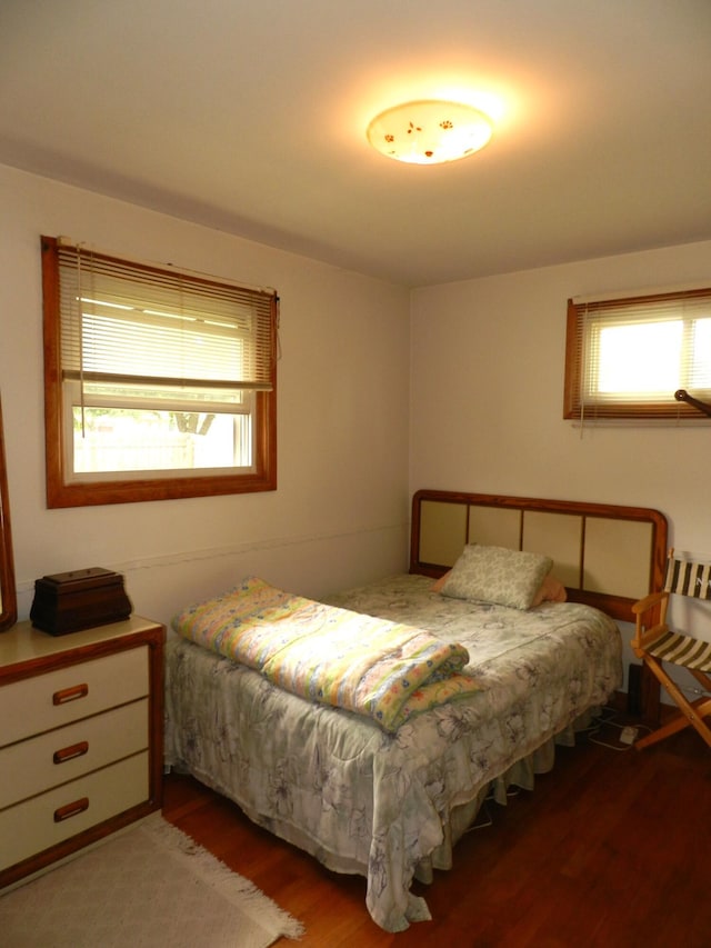 2865 Carrie Ln, Saint Joseph, MI 49085 - bedroom with multiple windows and light wood-type flooring