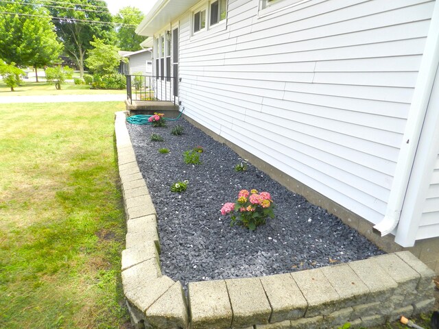 2865 Carrie Ln, Saint Joseph, MI 49085 - view of home's exterior featuring a yard
