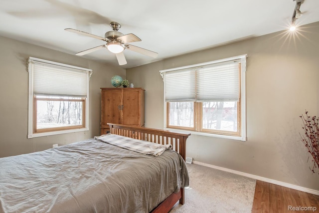 12109 Shaffer Rd, Davisburg, MI 48350 - bedroom with ceiling fan and wood finished floors