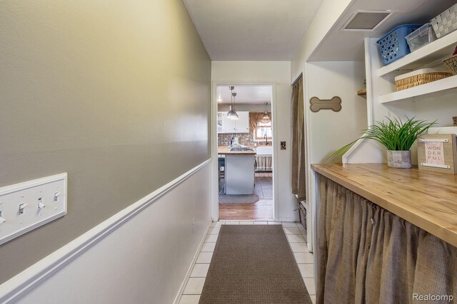 12109 Shaffer Rd, Davisburg, MI 48350 - hallway with light tile patterned floors