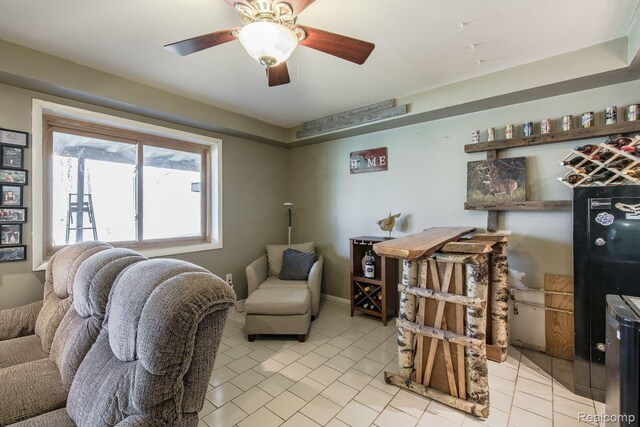12109 Shaffer Rd, Davisburg, MI 48350 - living room featuring light tile patterned floors and a ceiling fan