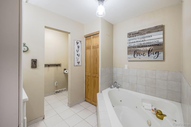 12109 Shaffer Rd, Davisburg, MI 48350 - bathroom with a jetted tub and tile patterned flooring