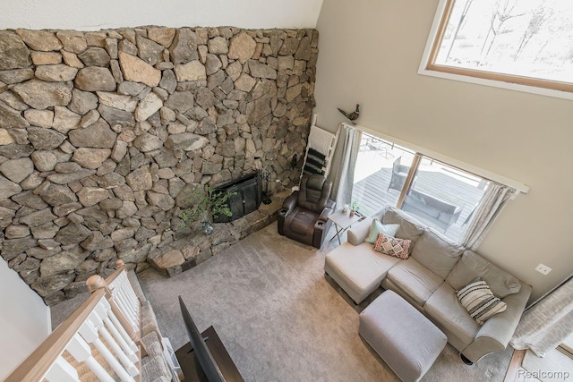 12109 Shaffer Rd, Davisburg, MI 48350 - living area featuring a fireplace with raised hearth and carpet