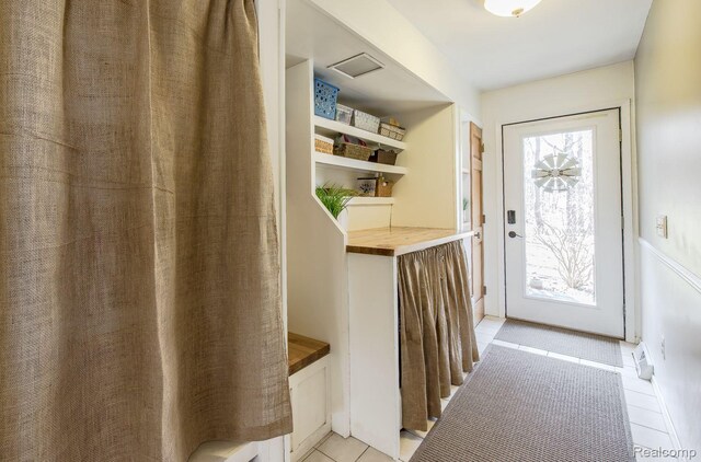 12109 Shaffer Rd, Davisburg, MI 48350 - doorway with light tile patterned flooring
