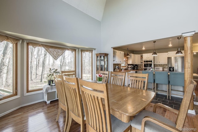 12109 Shaffer Rd, Davisburg, MI 48350 - dining area with wood-type flooring and high vaulted ceiling