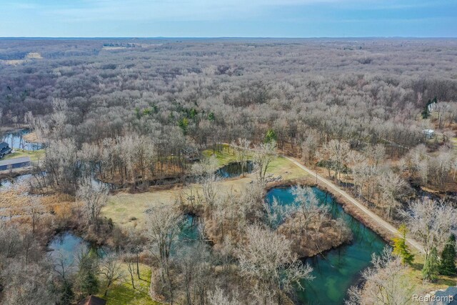 12109 Shaffer Rd, Davisburg, MI 48350 - aerial view of property and surrounding area featuring a heavily wooded area
